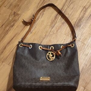 Michael Kors Drawstring Leather Canvas Bucket Bag Gromments Brown Monogram